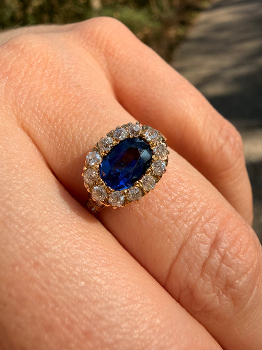 Antique yellow 14K unheated 1.05ctw royal blue sapphire and approx .38ctw diamond halo ring, size 6