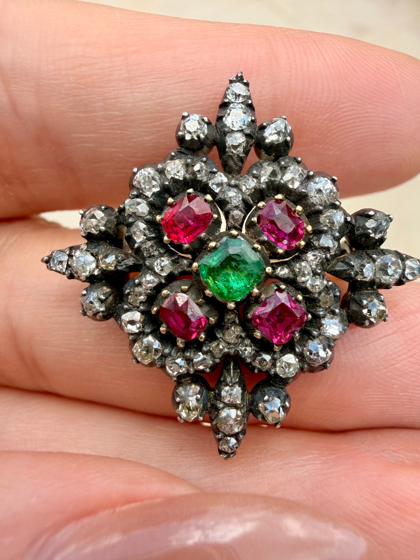 Antique 18K and silver approx 1.6 ctw old mine, peruzzi and old cut diamond, .75 ctw Burma ruby, and .38 ctw emerald brooch