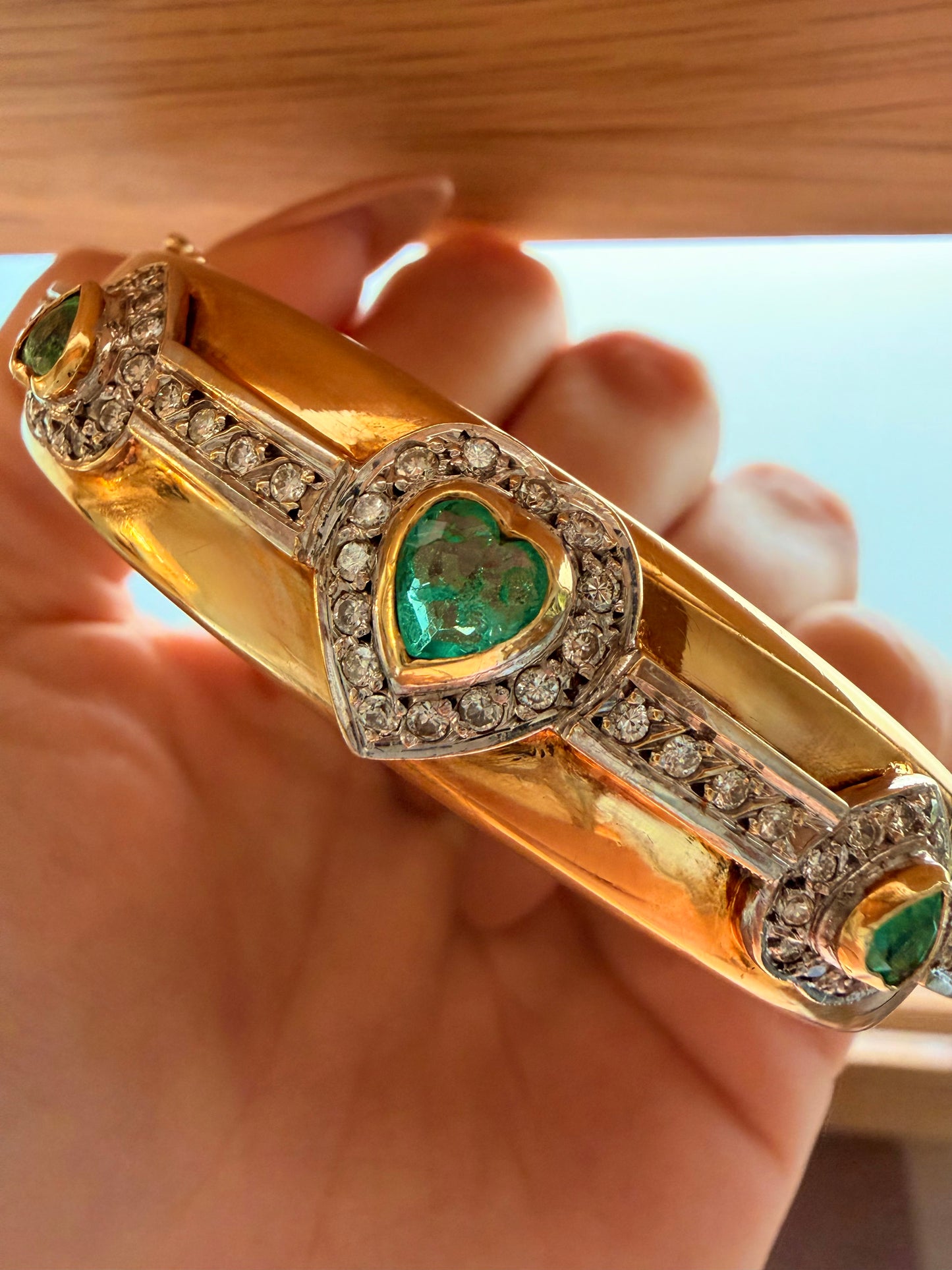 Vintage yellow 18K triple 1.73 ctw emerald and 1.14 ctw diamond heart bangle