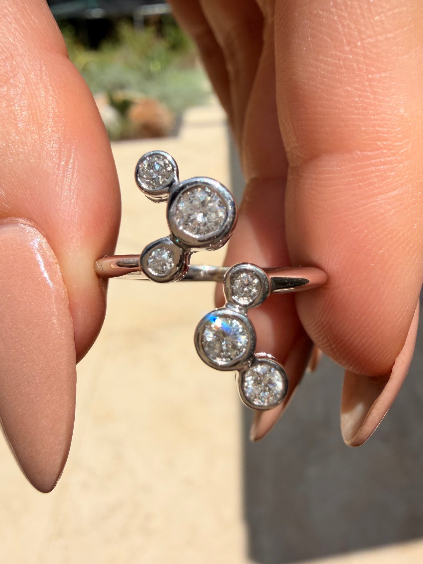 White 14K bezel set approx .55ctw diamond bubble ring, size 7.5