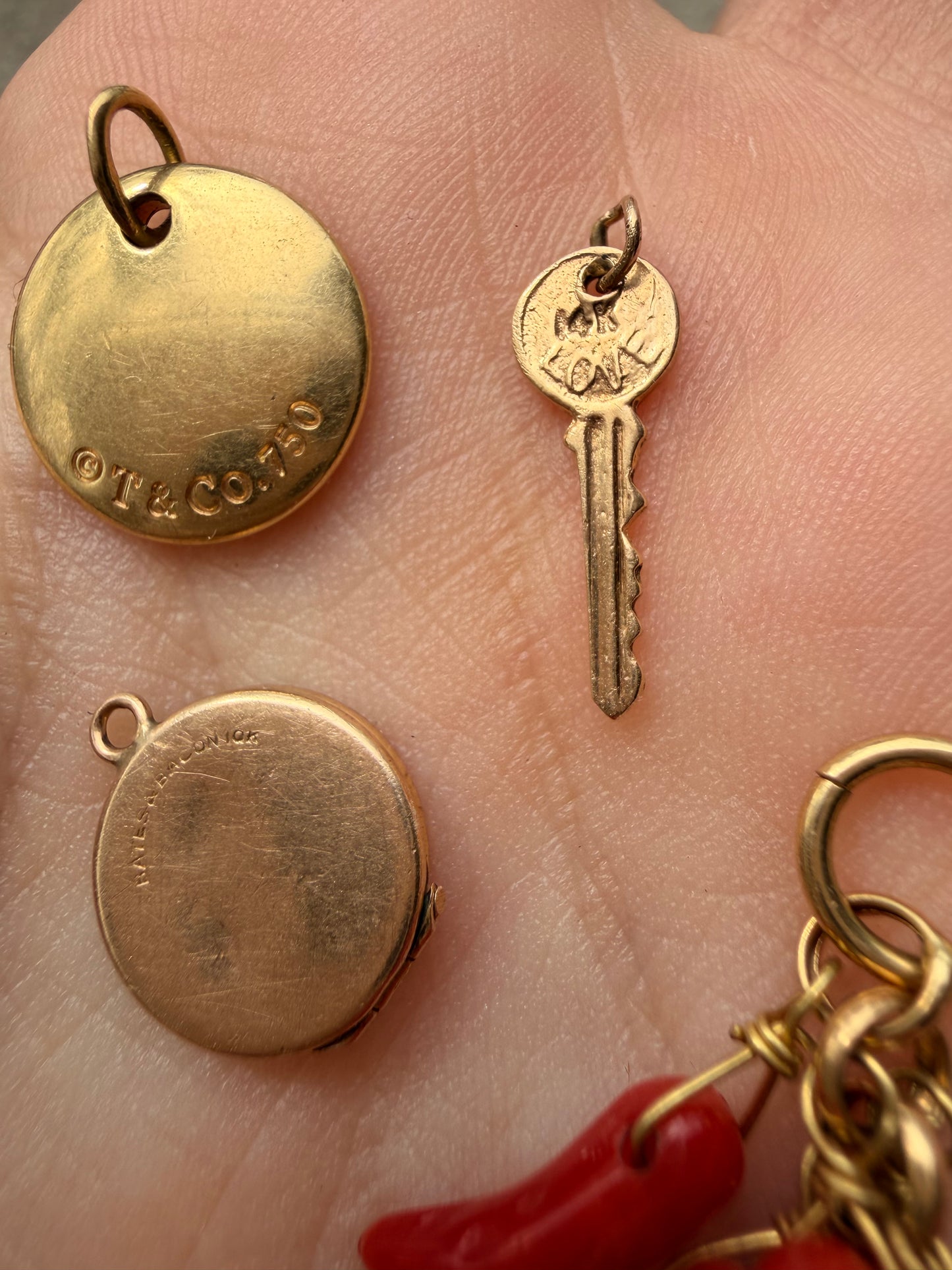 Yellow 18K gold Tiffany & Co cursive letter M charm