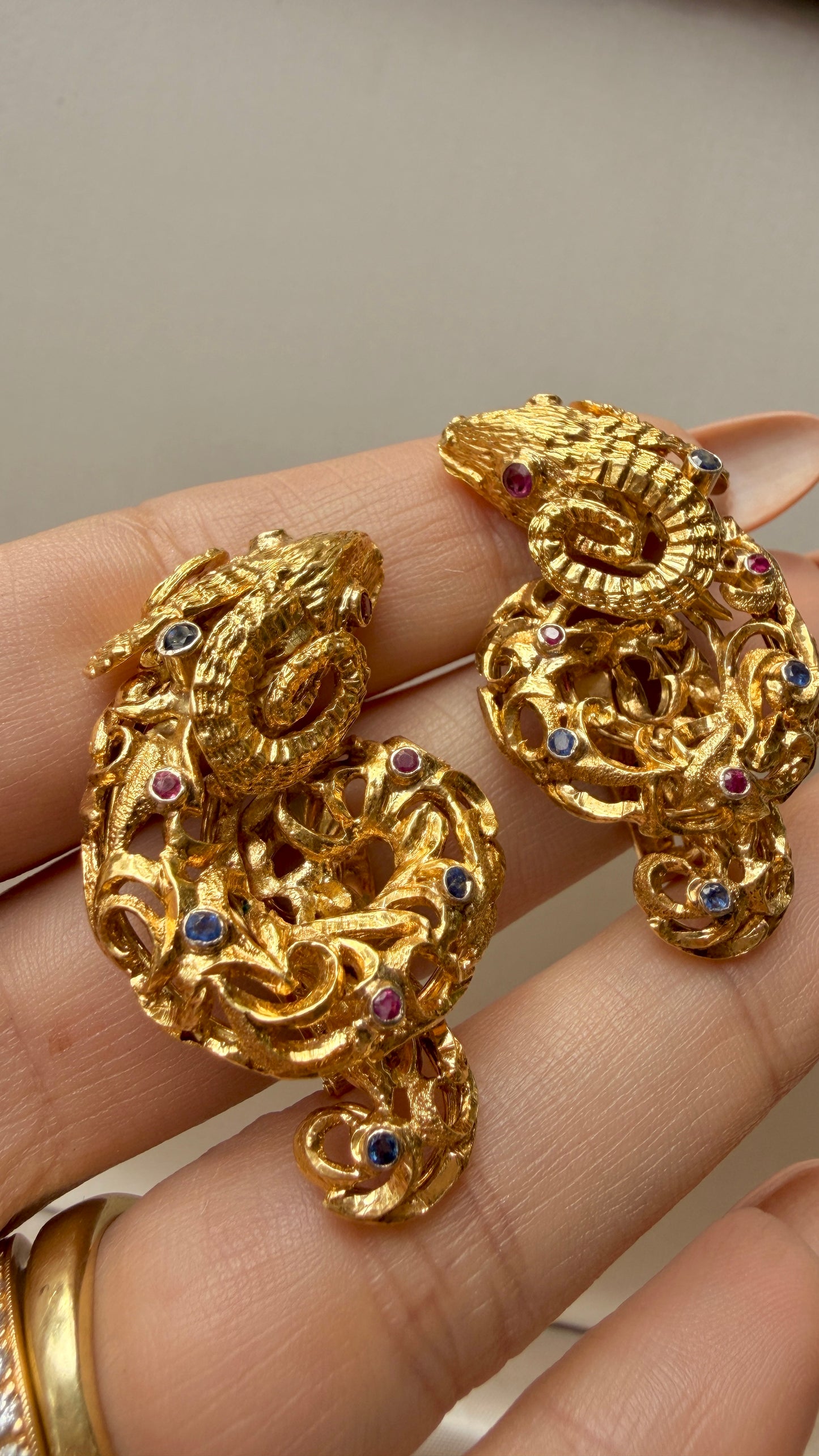 Vintage circa 1960s yellow 18K approx .6ctw sapphire and ruby ram clip statement earrings