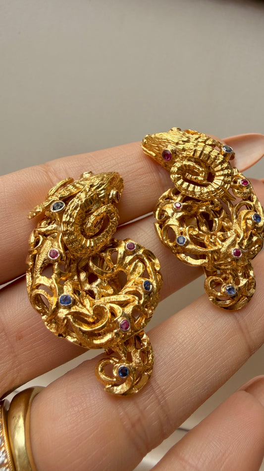 Vintage circa 1960s yellow 18K approx .6ctw sapphire and ruby ram clip statement earrings