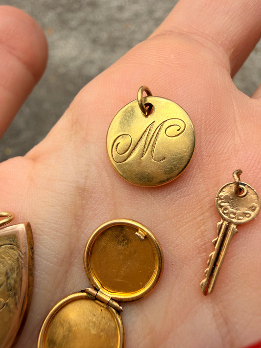 Yellow 18K gold Tiffany & Co cursive letter M charm