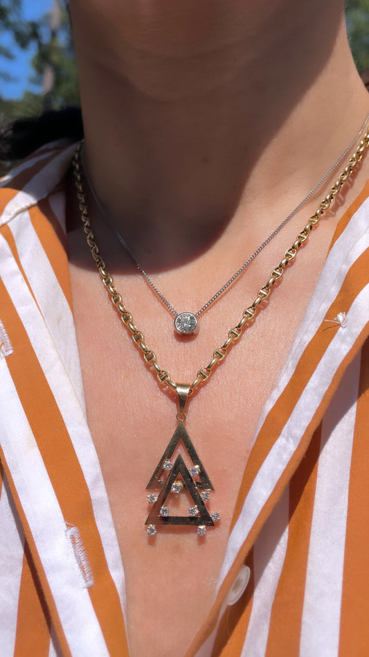 Vintage yellow 14K and .33 ctw double triangle diamond pendant