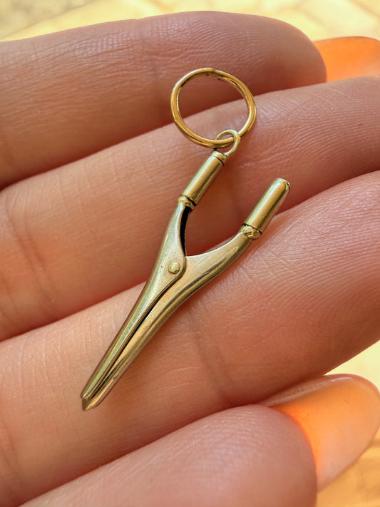 Vintage 14K articulated curling iron charm