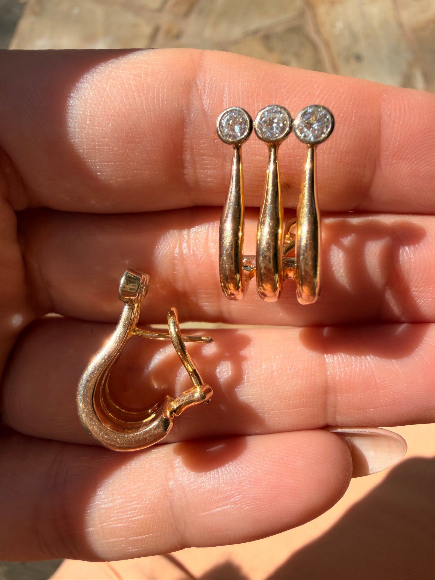 Vintage 14K and approx .84ctw bezel set diamond omega back earrings