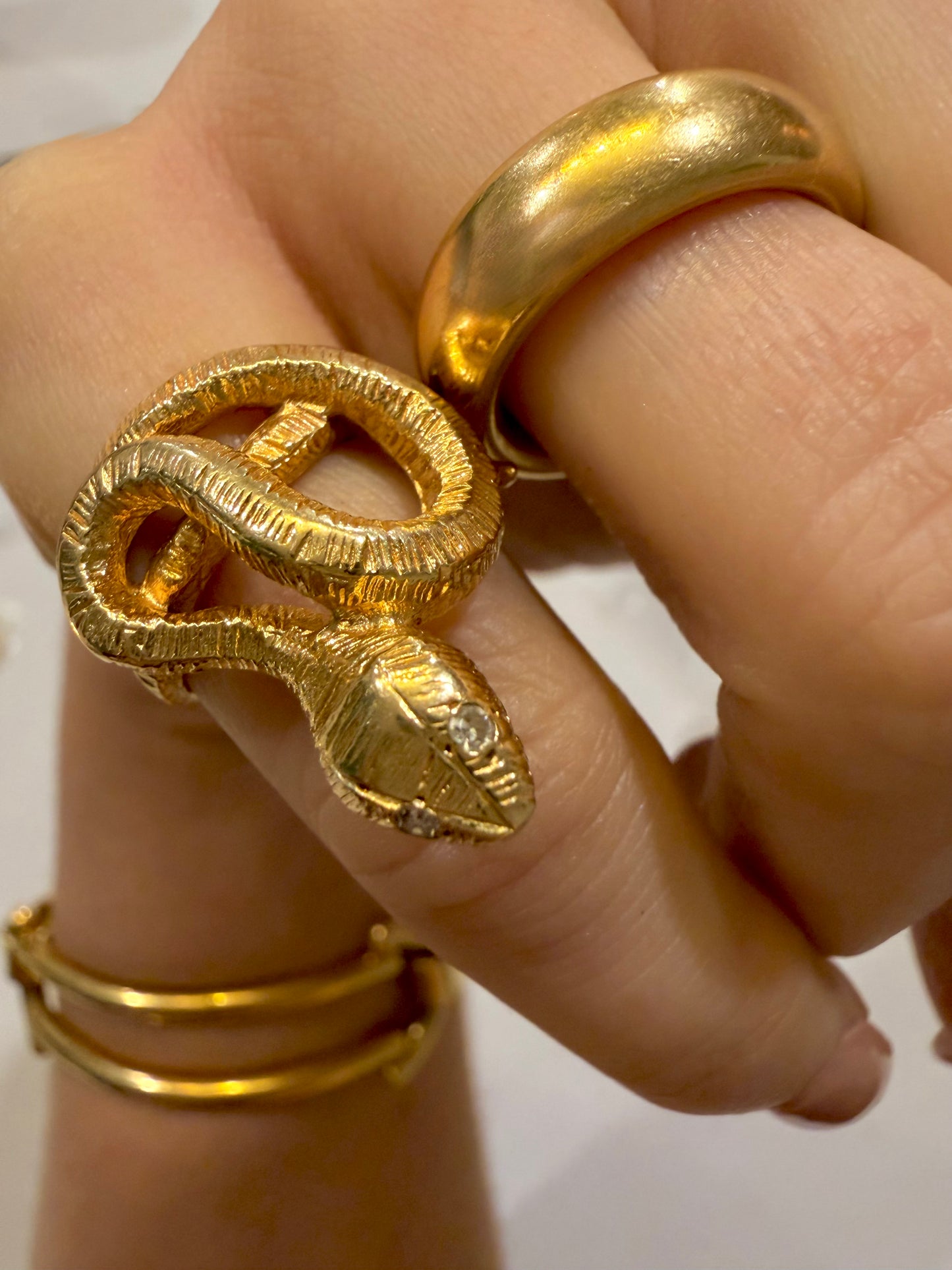 Vintage yellow 14K textured coiled snake ring with diamond eyes, size 4.25