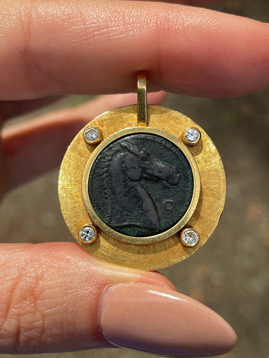 Vintage yellow 18K horse coin pendant with approx .15 ctw diamonds