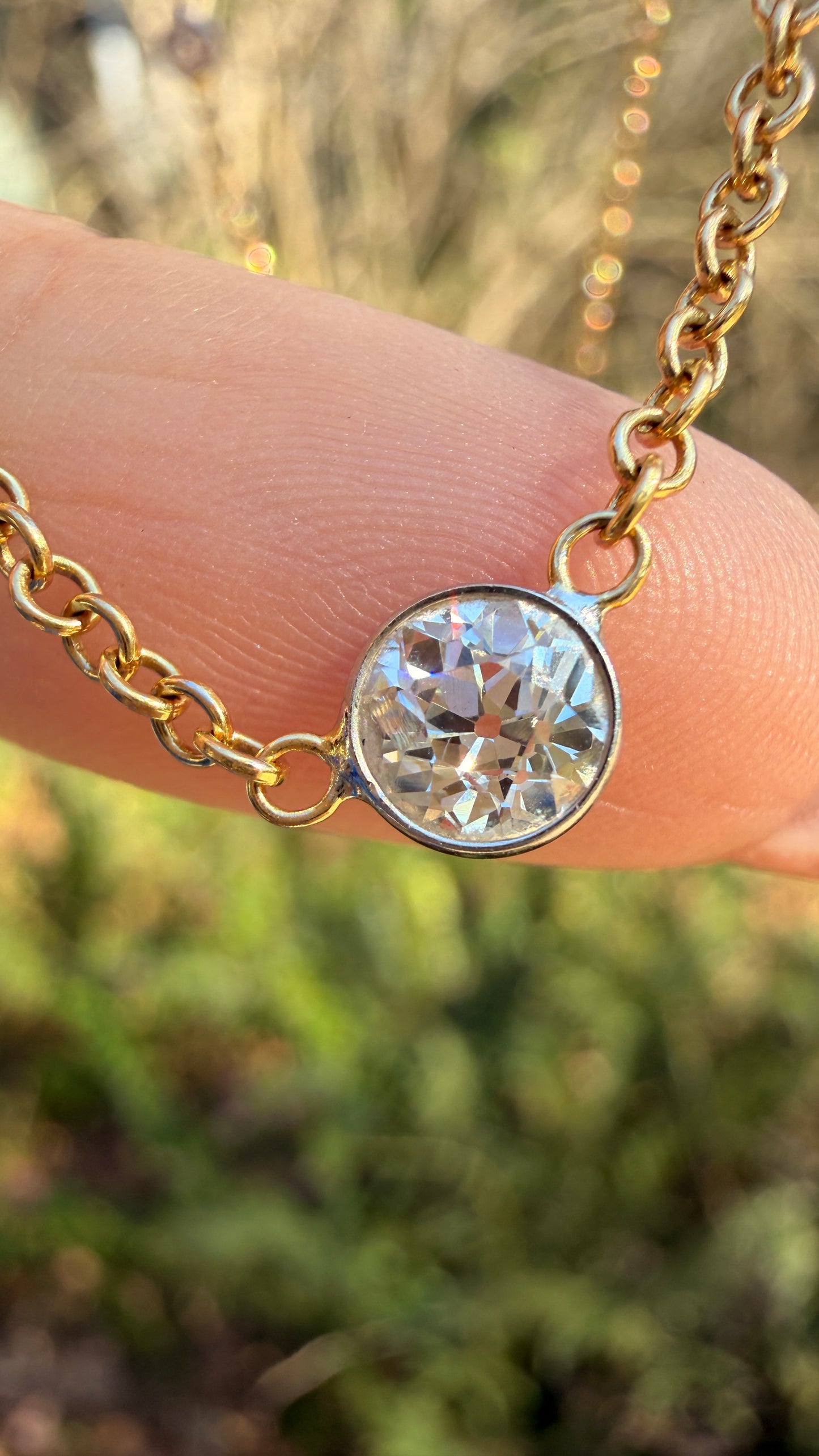 Vintage 18K approx 1.2ctw Old European Cut diamond and round diamond station chain, 18 3/8 inch