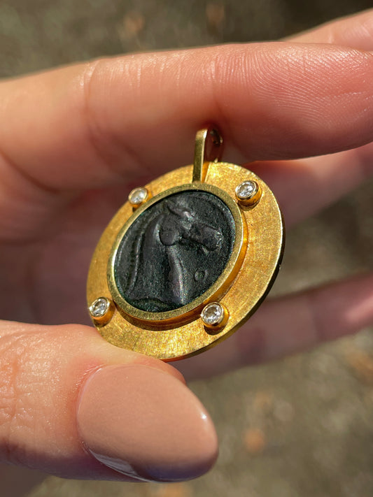 Vintage yellow 18K horse coin pendant with approx .15 ctw diamonds