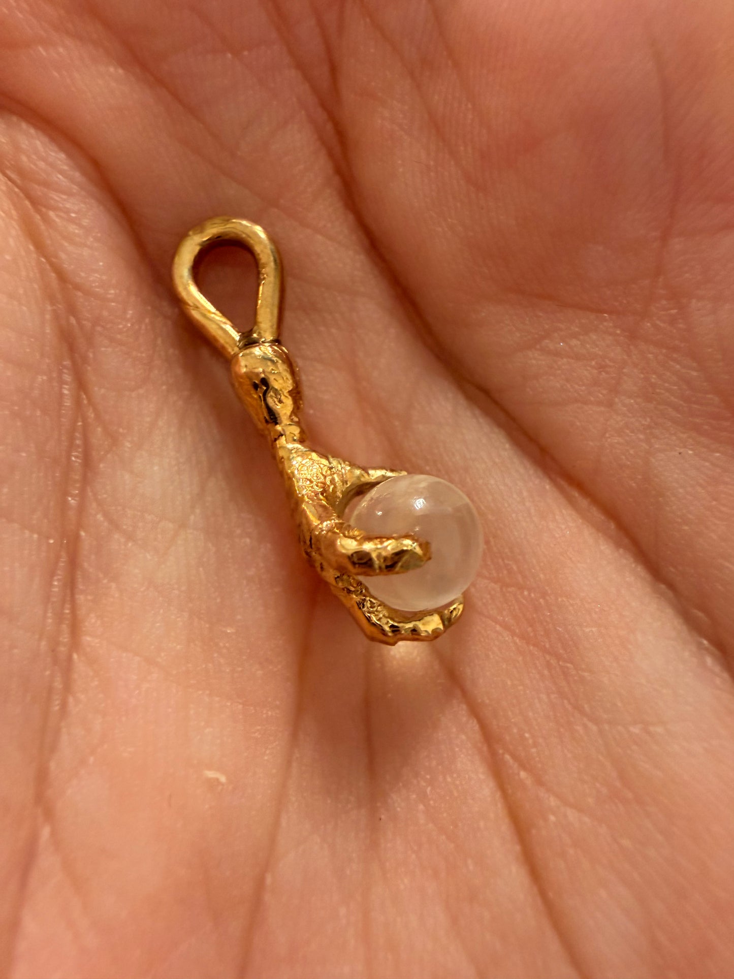 Antique yellow 14K gold and moonstone orb talon charm