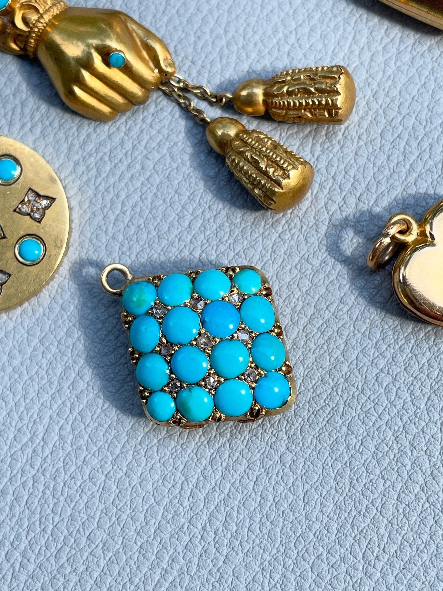 Antique yellow 18K rose cut diamond and turquoise diamond shaped locket with curved back glass
