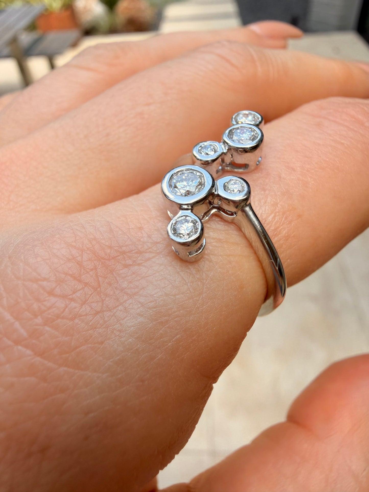 White 14K bezel set approx .55ctw diamond bubble ring, size 7.5