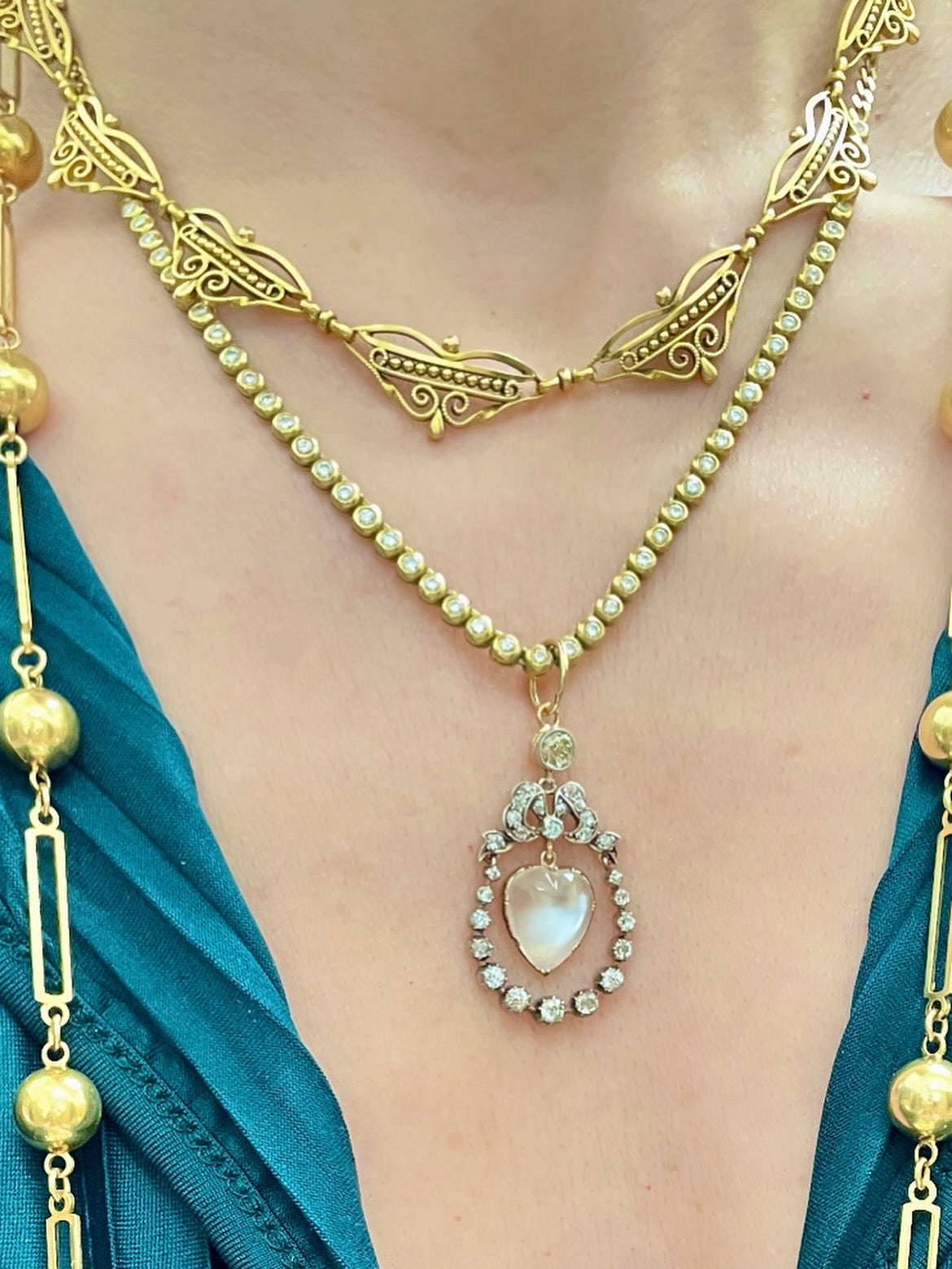 Incredible Antique 18K and 14K approx 1.22 ctw diamond and heart shaped moonstone bow pendant