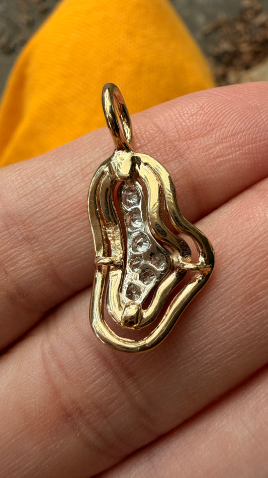 Vintage 14K .2 ctw diamond pebble shaped charm