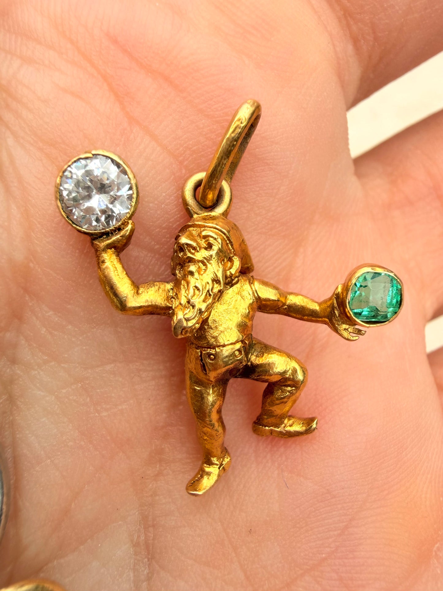 Antique yellow 19K gnome pendant with approx .27 ctw diamond and .15 ctw emerald