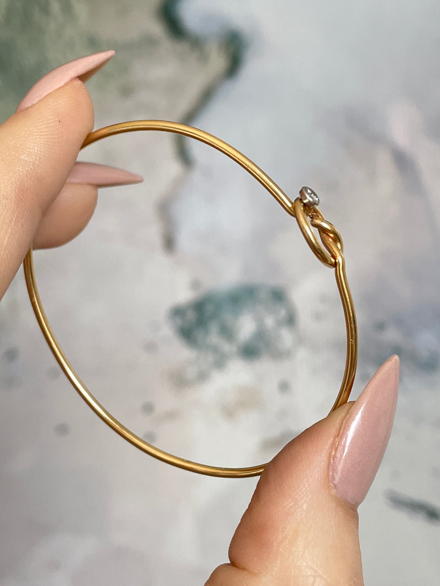 Vintage yellow 14K gold approx .03ctw diamond love knot bangle