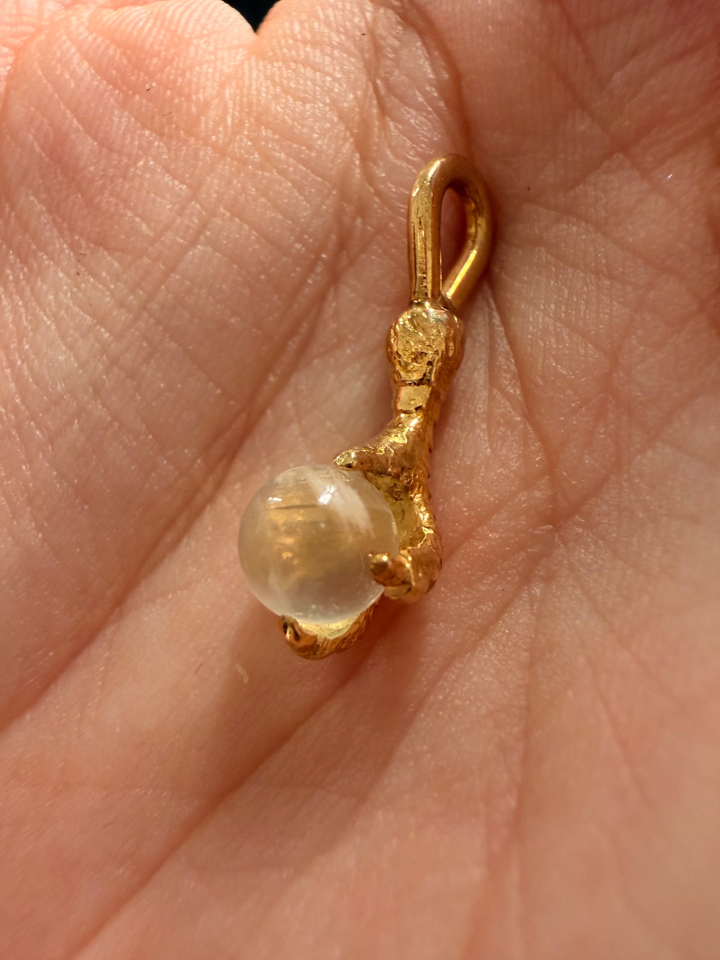 Antique yellow 14K gold and moonstone orb talon charm