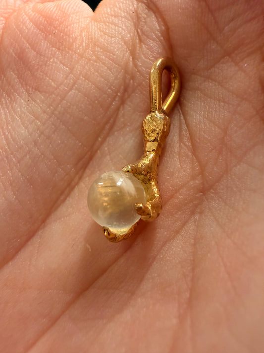 Antique yellow 14K gold and moonstone orb talon charm