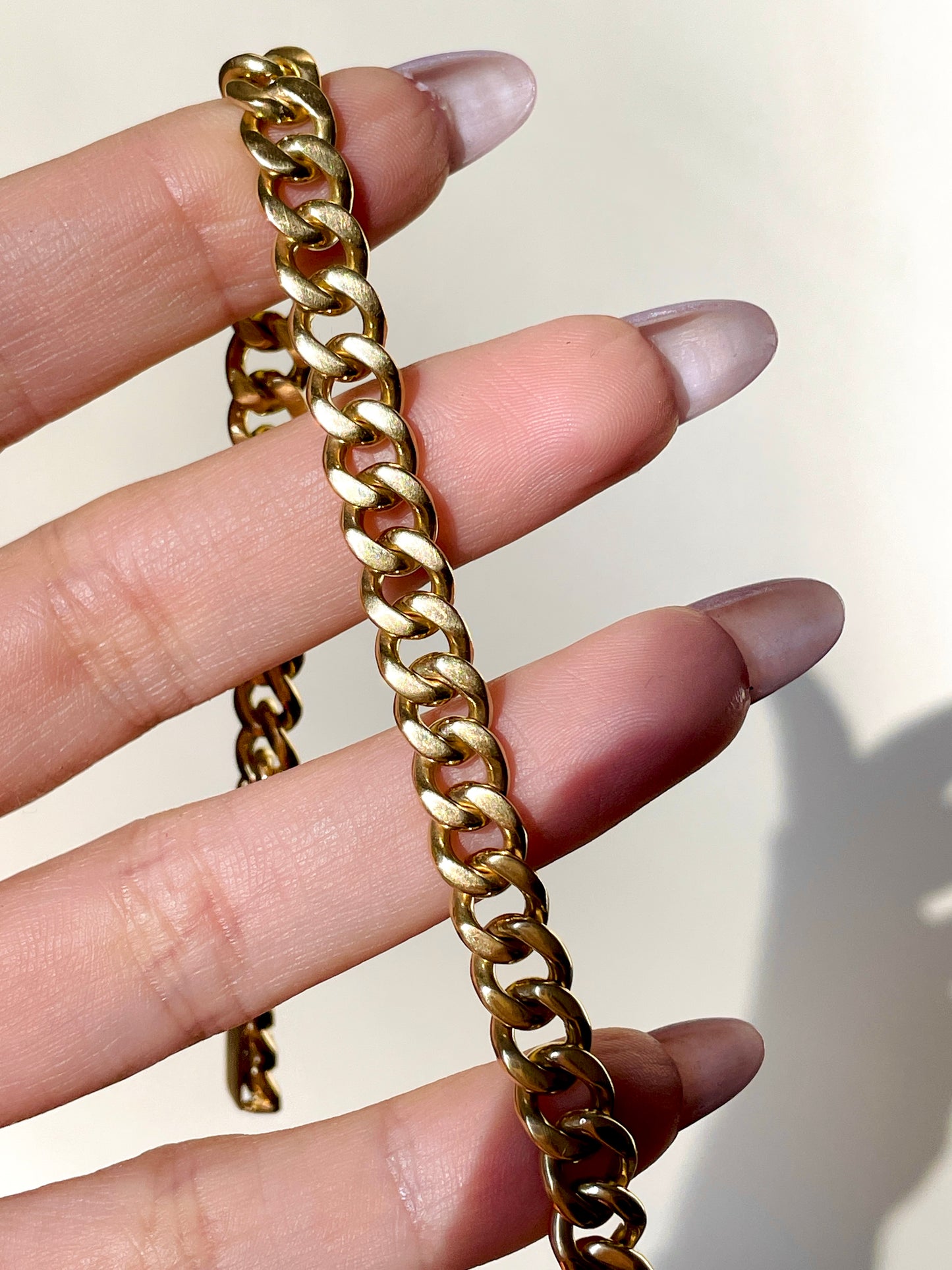 Vintage solid rosy yellow 18K gold curb bracelet with safety chain, 8 and 3/8 inch