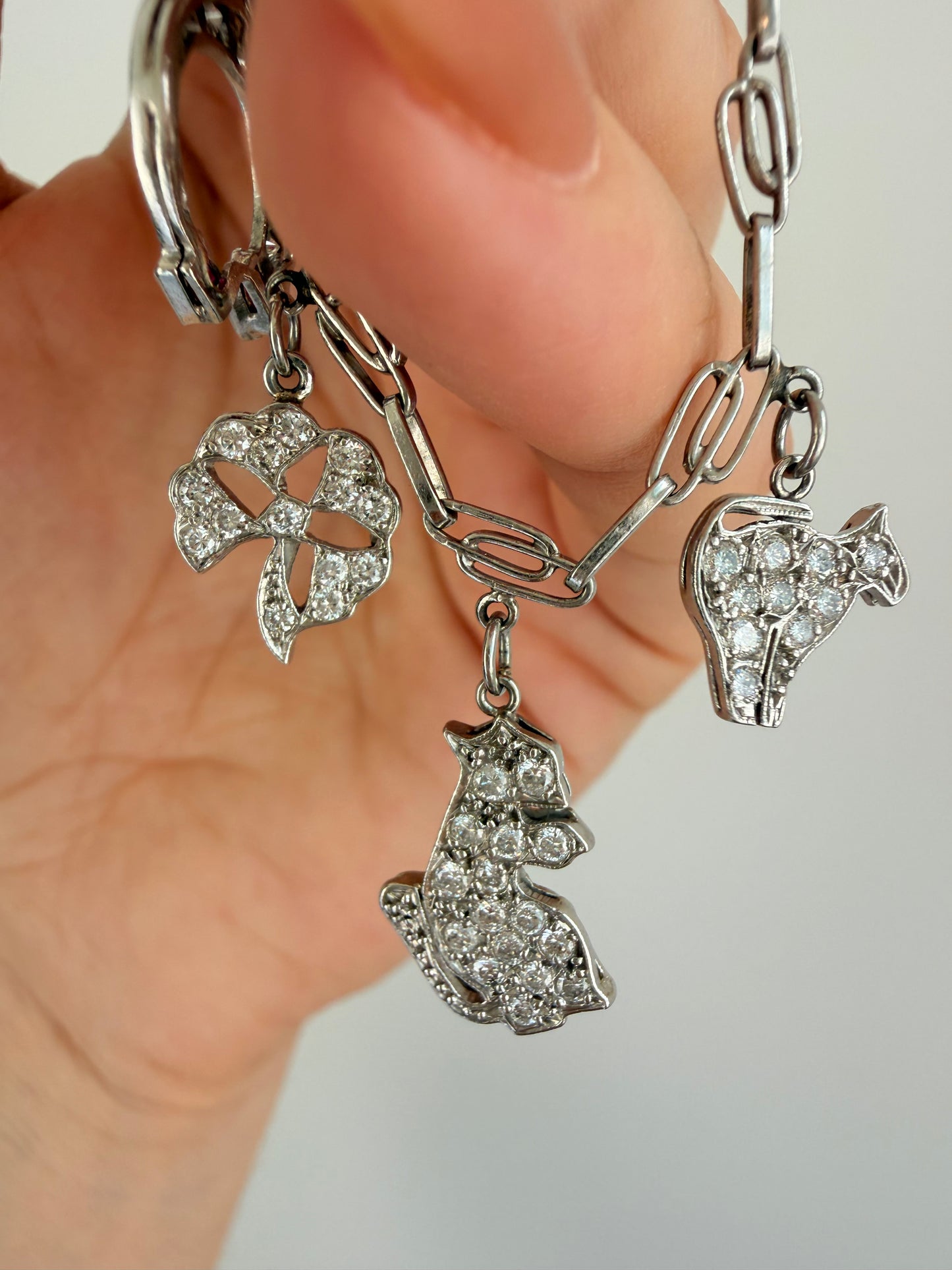 Antique platinum Art Deco charm bracelet with 1 ctw diamonds, sapphires and rubies, 7 inch
