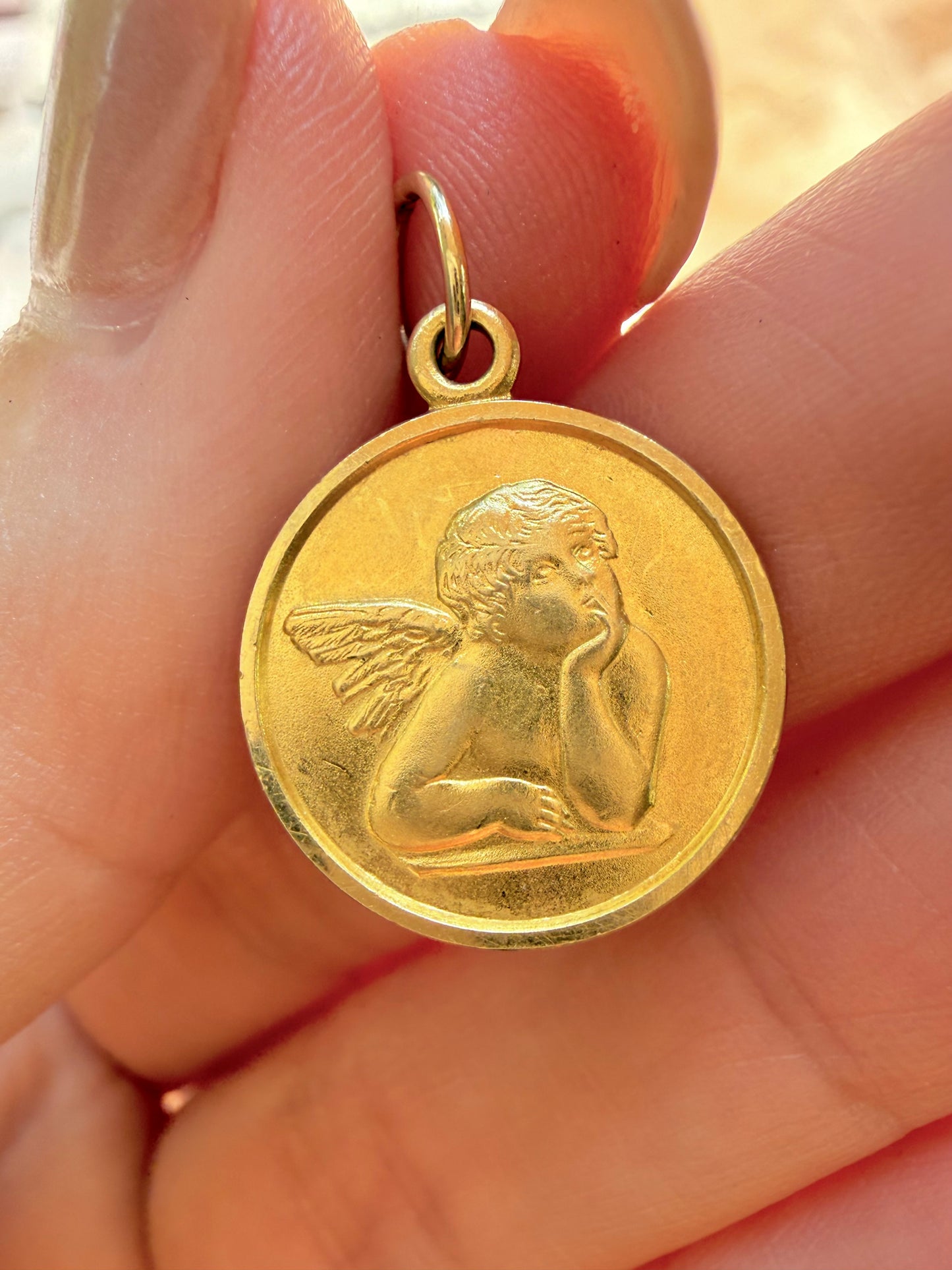 Vintage yellow 14K cherub medal charm