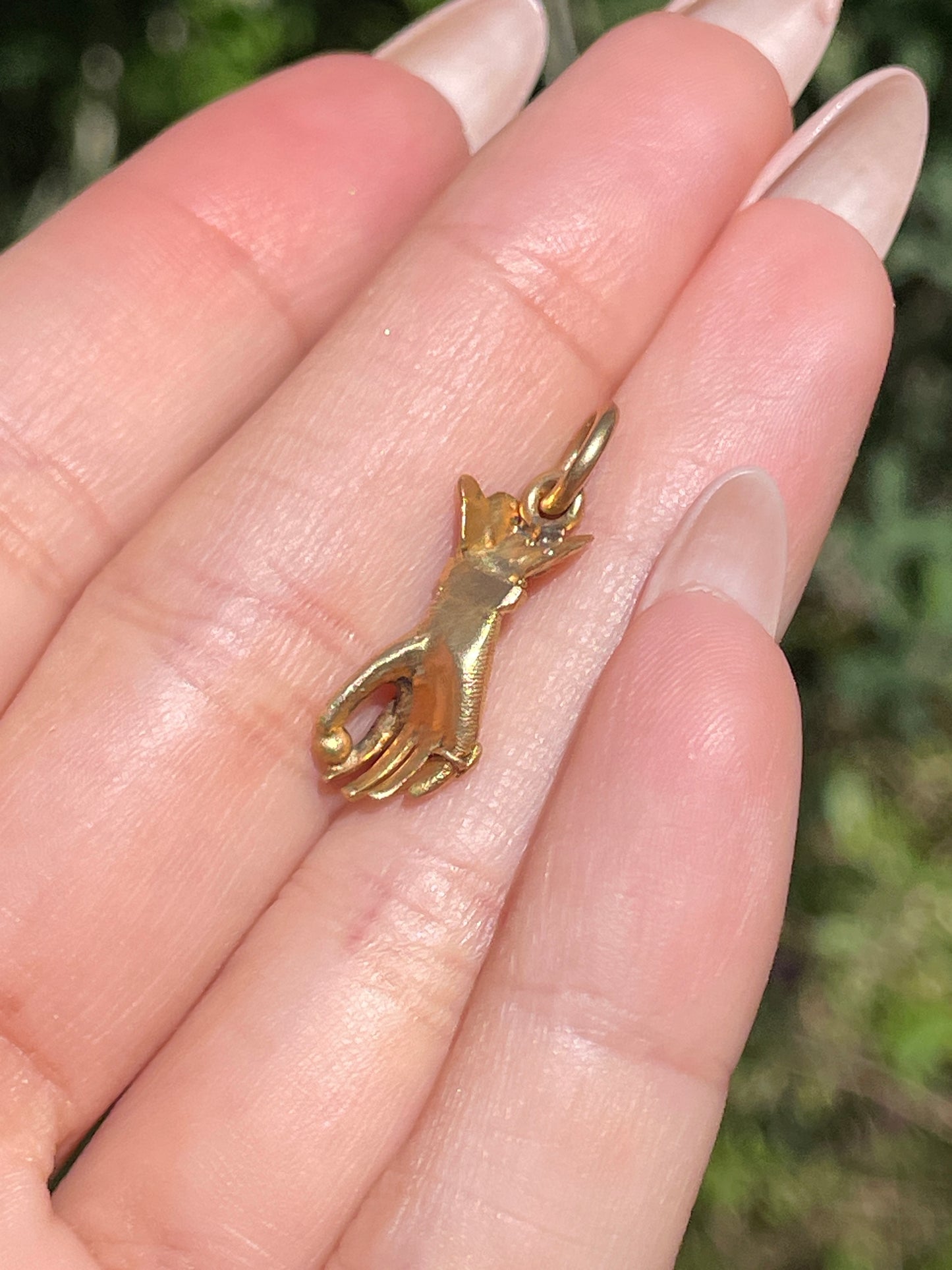 Antique yellow 18K hand charm wearing emerald ring