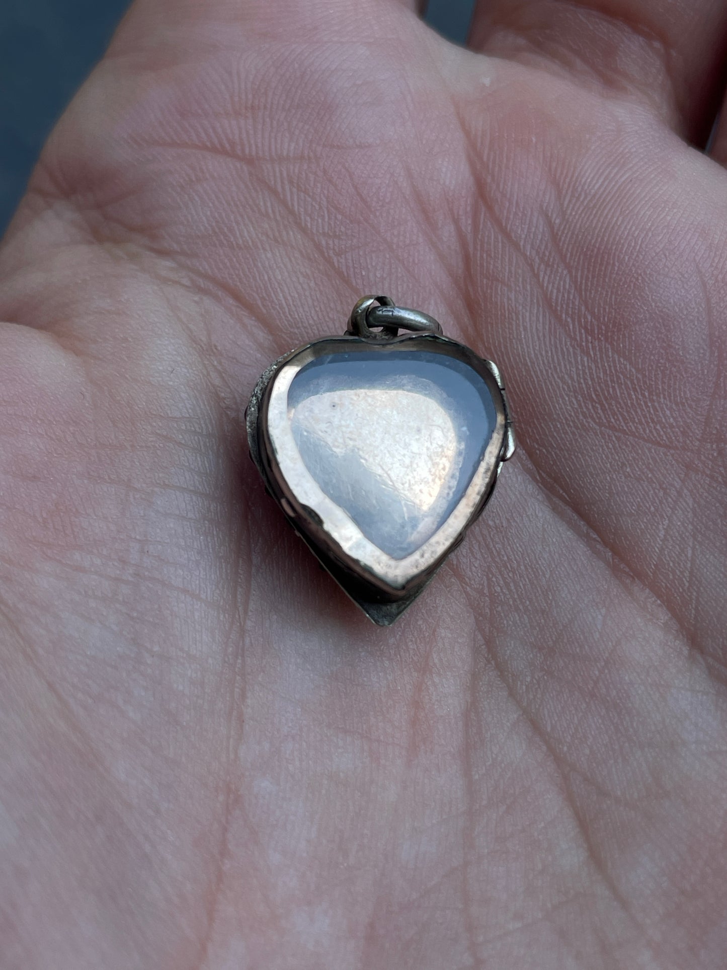 Antique sterling garnet heart celestial glass back locket charm