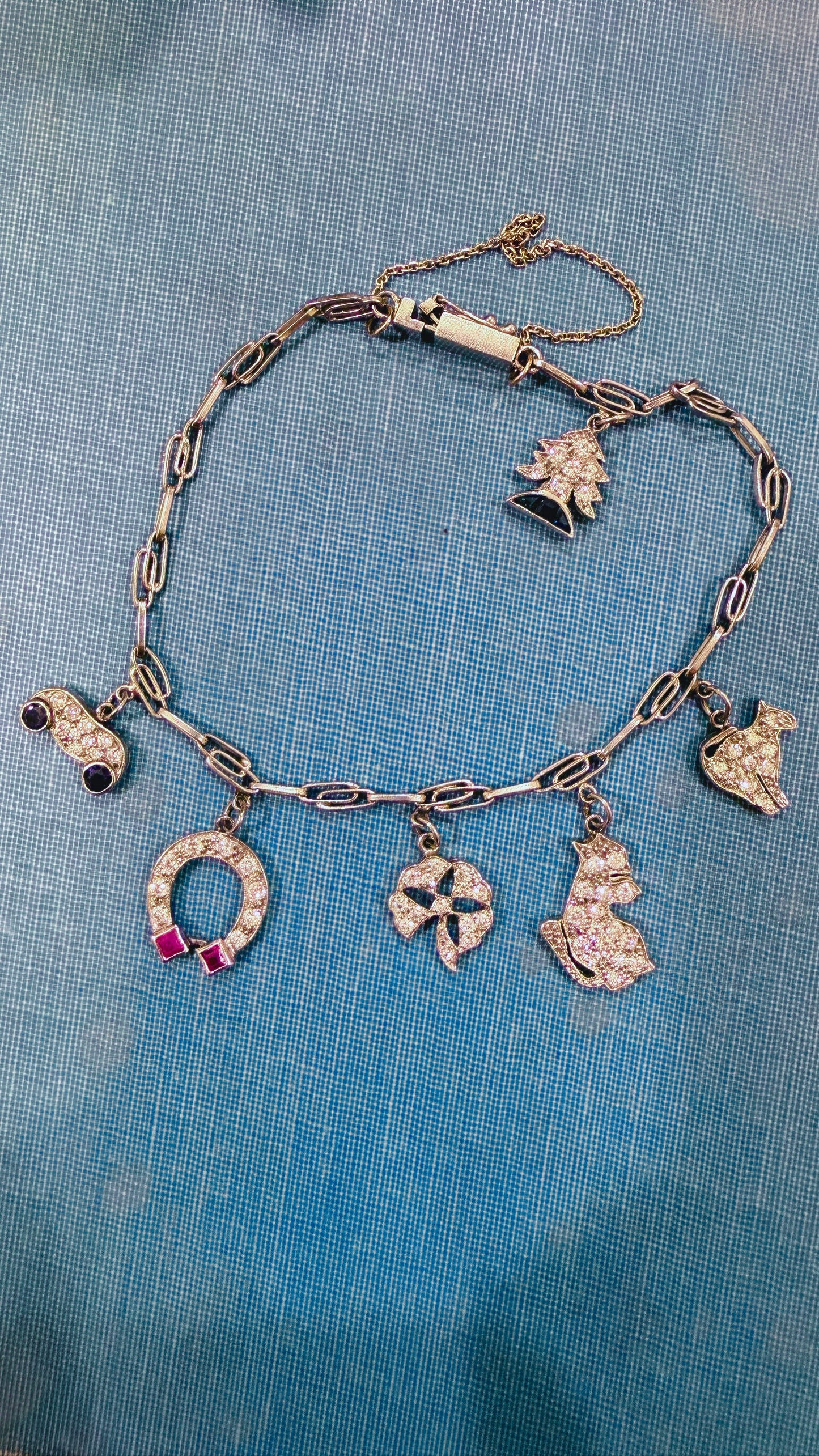 Antique platinum Art Deco charm bracelet with 1 ctw diamonds, sapphires and rubies, 7 inch