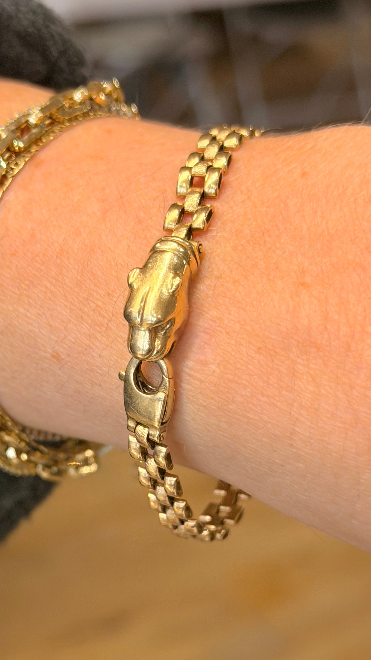 Vintage yellow 14K panther link bracelet with integrated panther head clasp, 7 inch