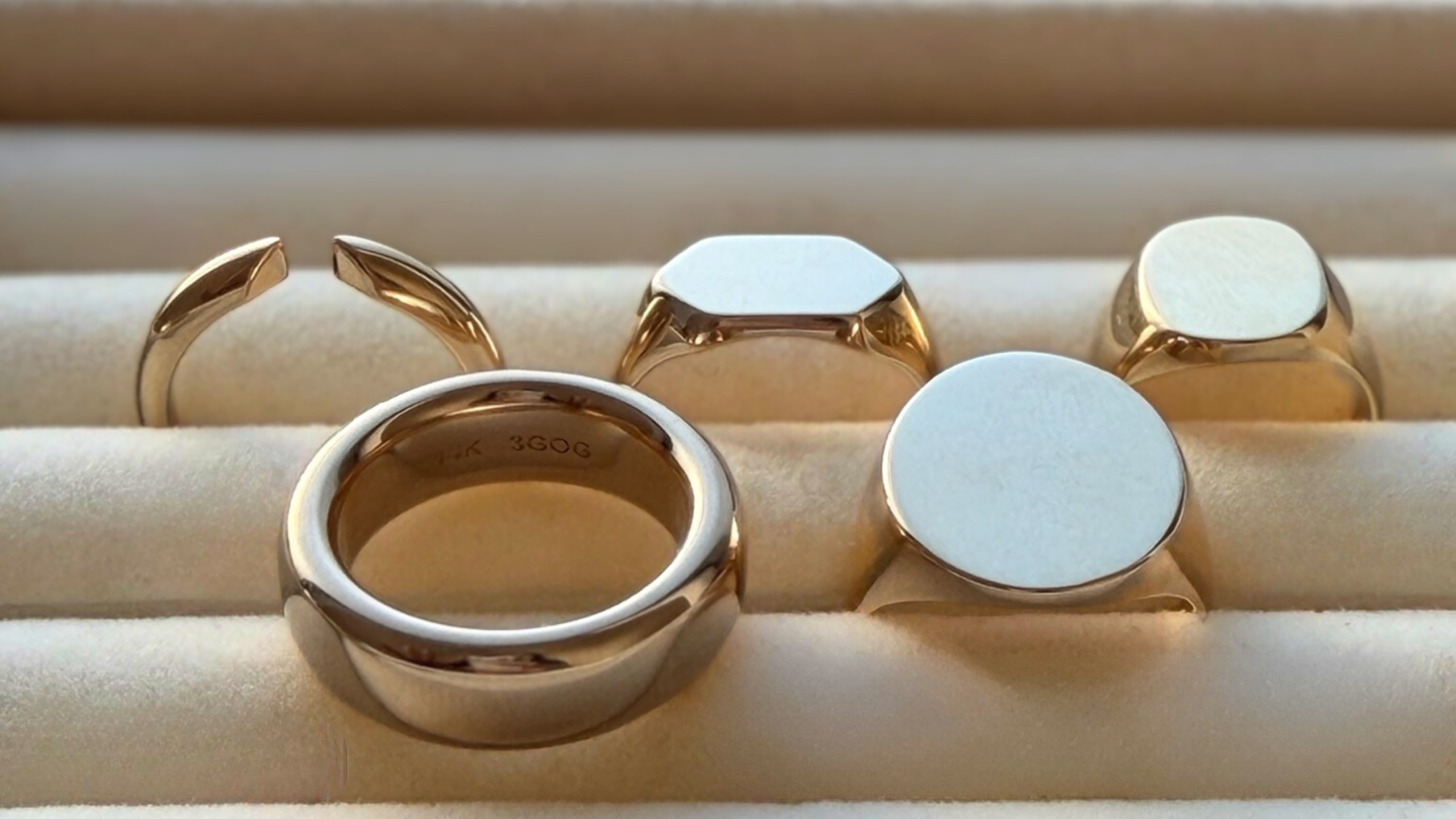 Classic gold rings you'll wear everyday: the original 3GOG Chubby Donut Band, the Cut Open gold stacking band, and Blank Slate signet rings shown in solid 14k gold.