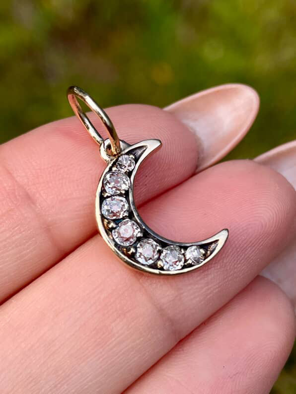 Vintage yellow 14K approx .52 ctw old mine cut diamond crescent pendant