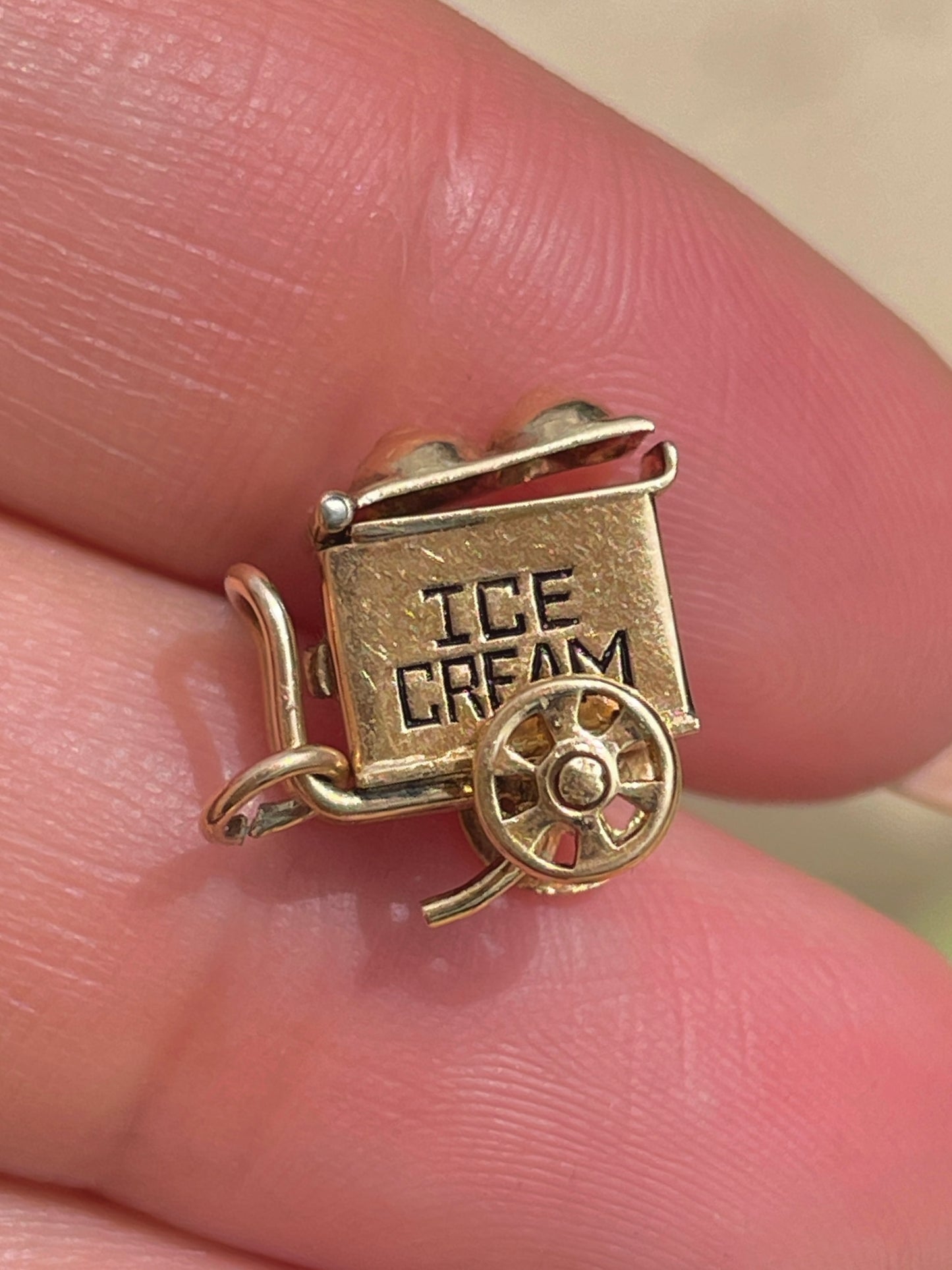 Vintage yellow 14K articulated ice cream truck with enamel