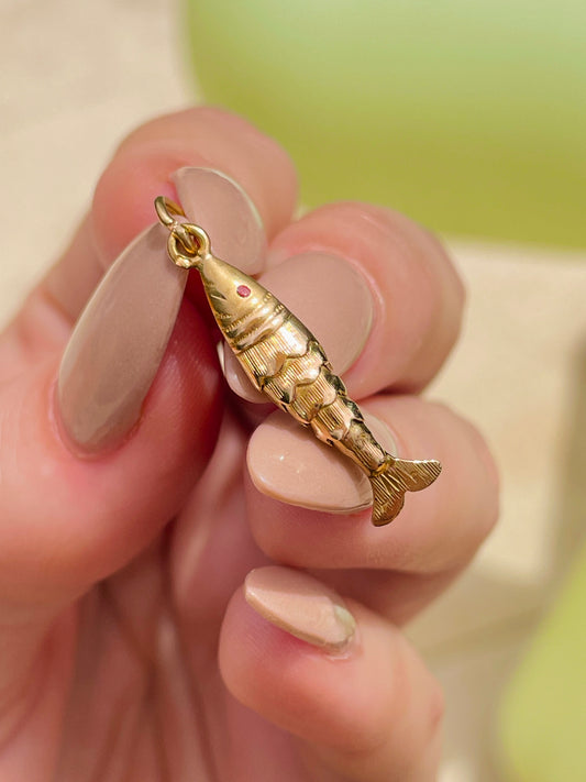 Vintage yellow 18K articulated fish with red eye