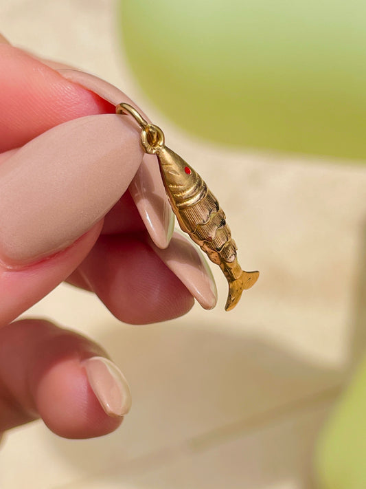 Vintage yellow 18K articulated fish with red eye