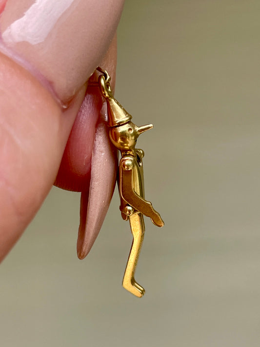Vintage yellow 18K articulated Pinocchio charm