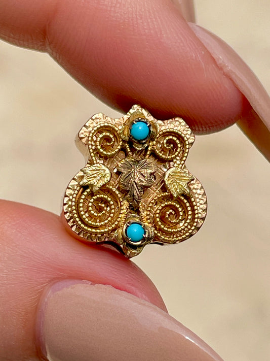 Antique yellow 14K crest shaped slider with leaves and turquoise details