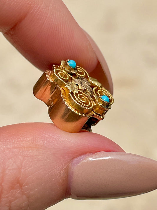Antique yellow 14K crest shaped slider with leaves and turquoise details