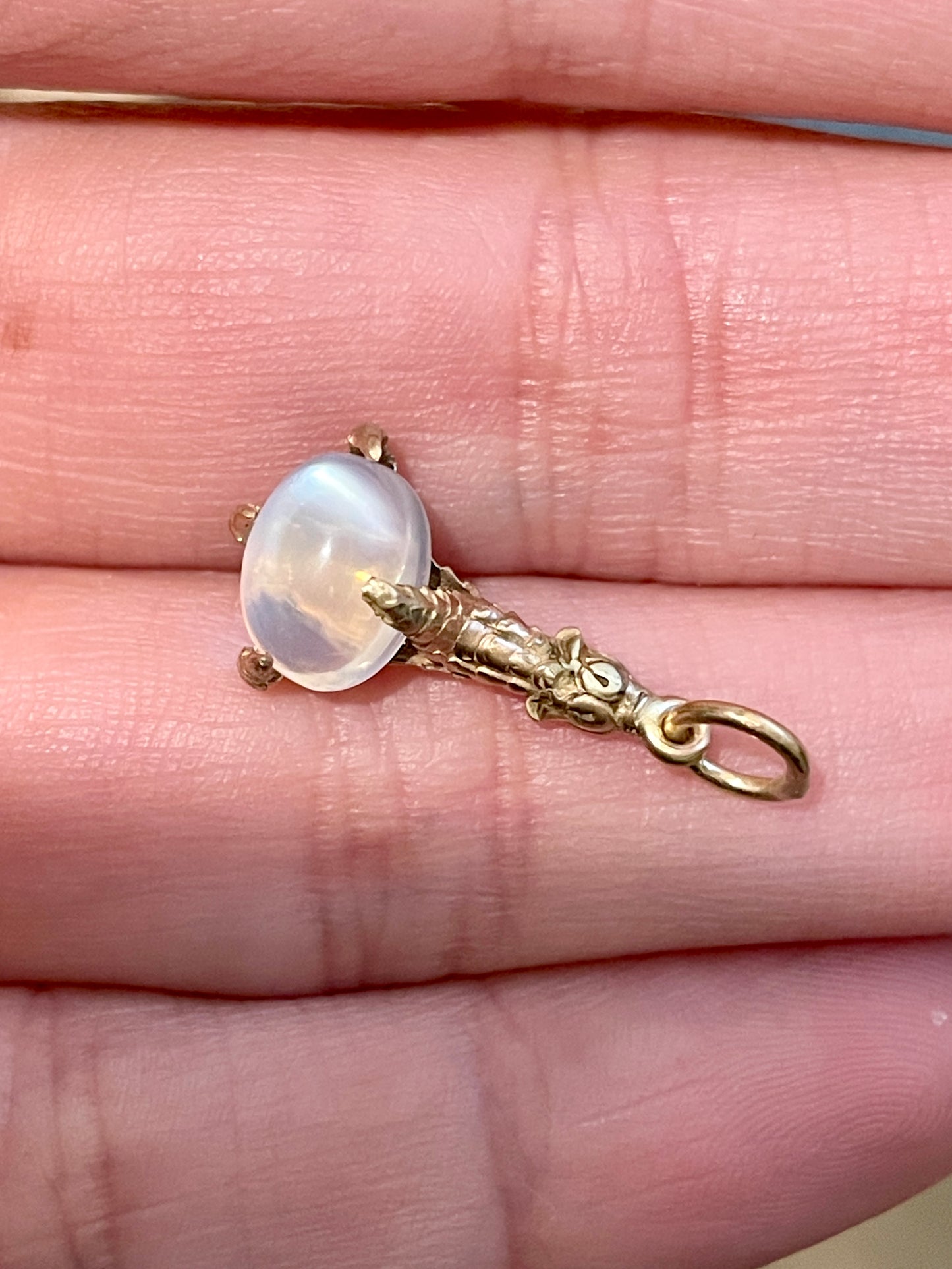 Antique yellow 14K Victorian engraved claw charm with moonstone