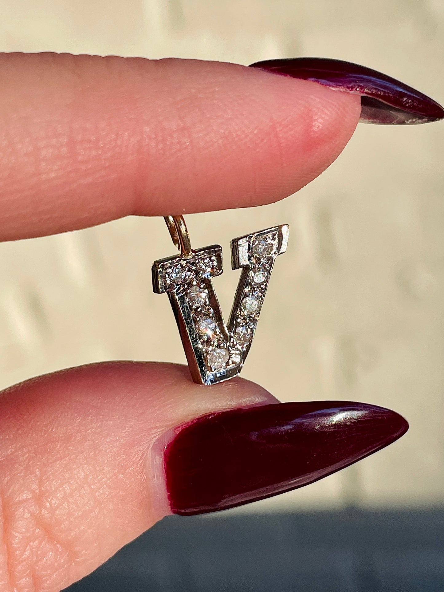 Vintage yellow and white 14K letter V charm with approx .27 ctw diamonds