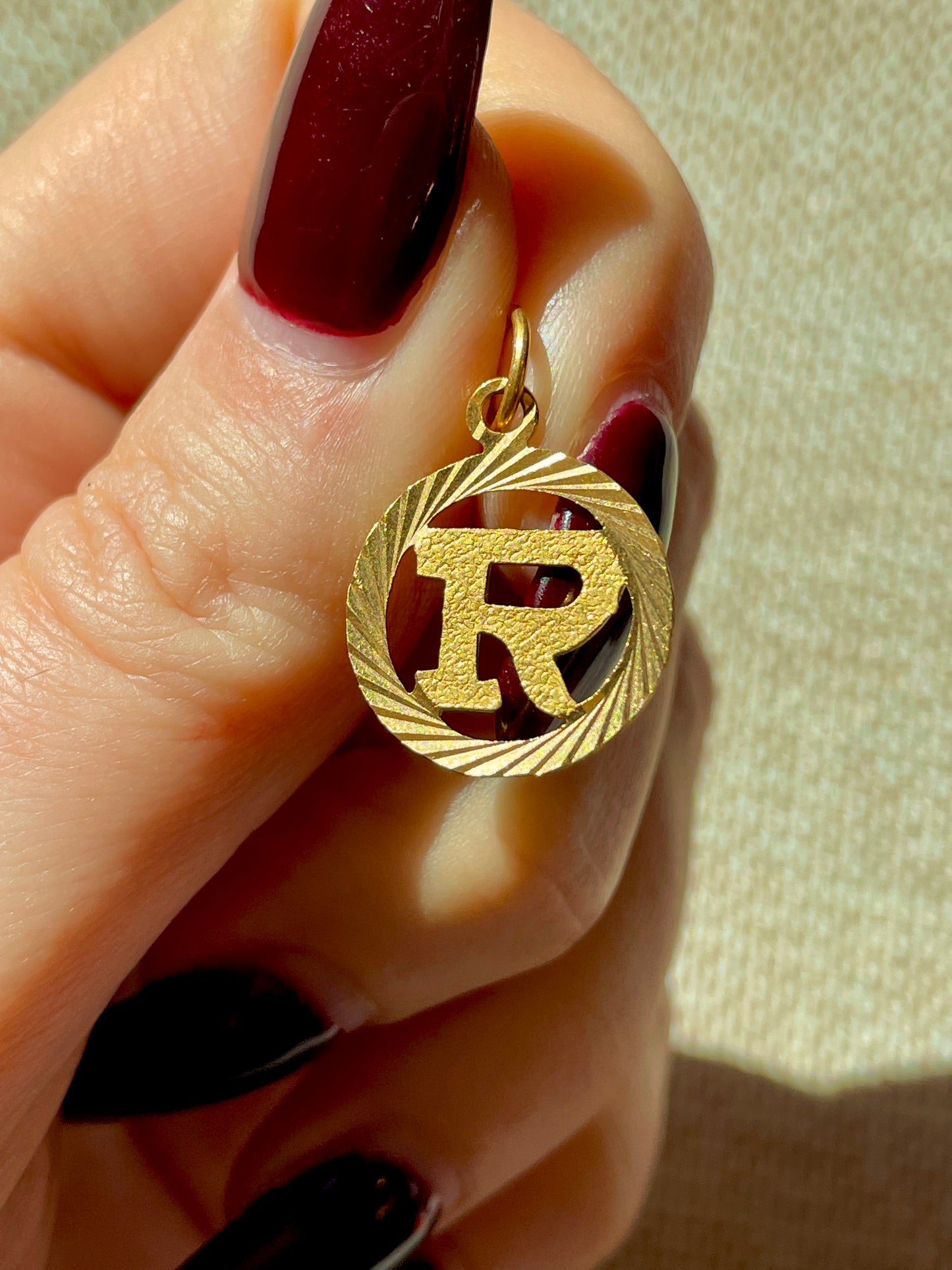 Vintage yellow 22K letter R engine turned charm