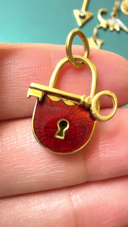 Vintage yellow 18K gold and red enamel lock and key pendant