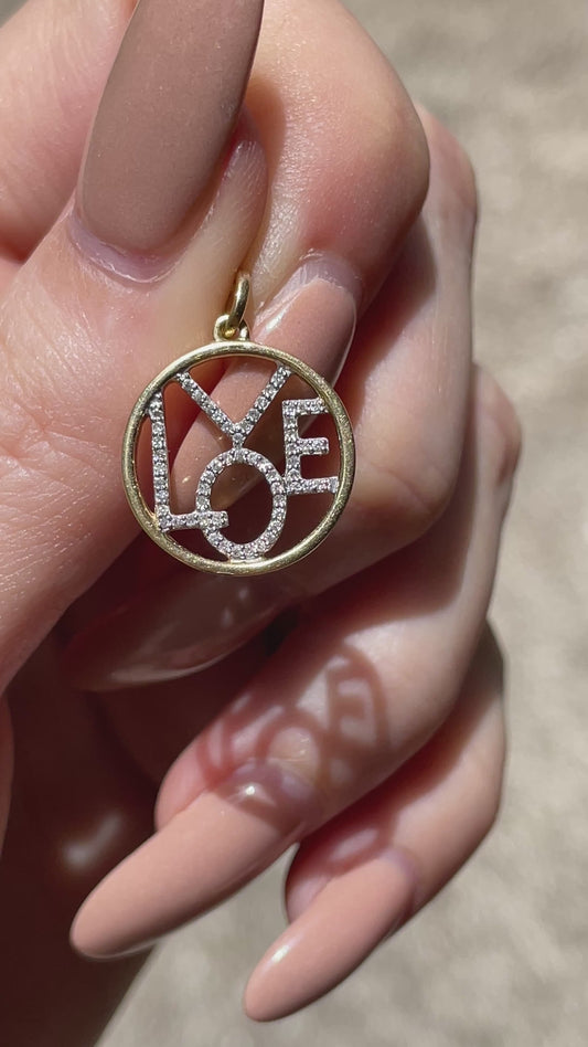 Vintage yellow 14K approx .14ctw diamond LOVE charm