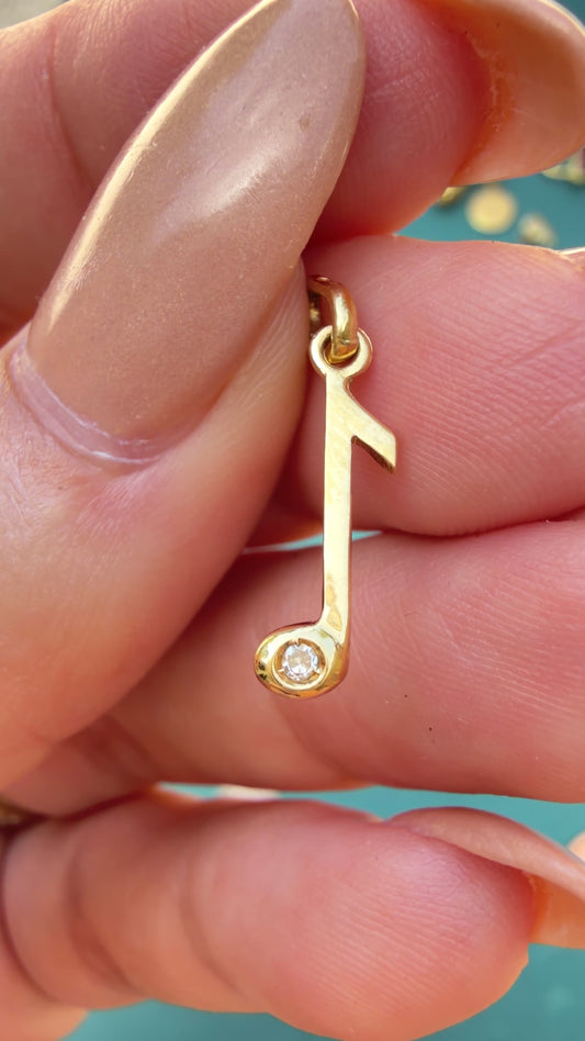 Vintage yellow 18K gold and diamond music note charm