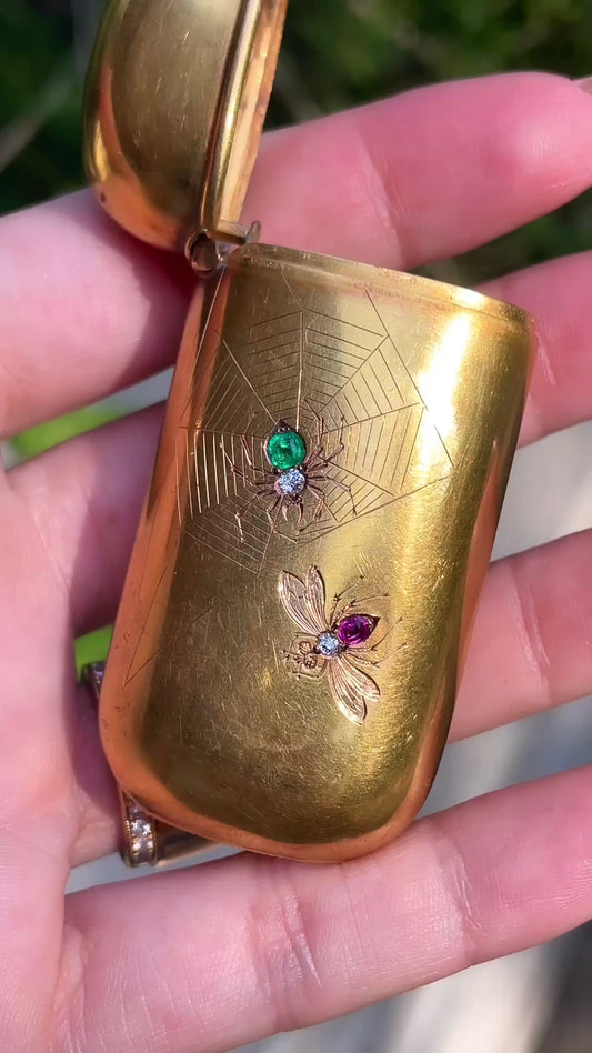 Antique 14K and 18K spider and fly engraved vesta with emerald, ruby and old mine cut diamonds