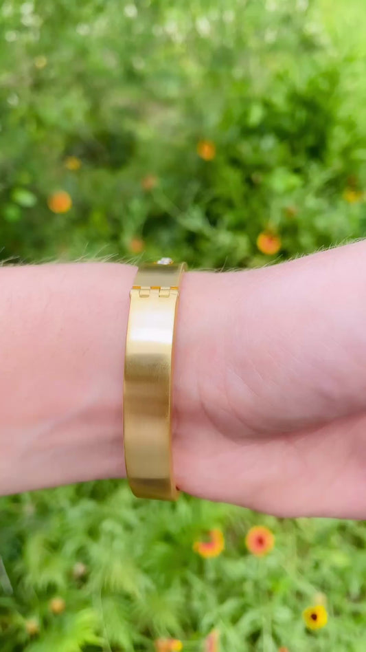 Vintage yellow 18K hinge bangle with 1.5 ctw kinetic sliding diamond bezels